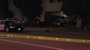 Homicide detectives were investigating a fatal shooting inside a Van Nuys apartment garage on March 18, 2015. (Credit: KTLA) 