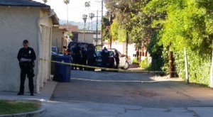 LAPD officers were investigation a deadly stabbing in a Van Nuys alley on March 24, 2015. (Credit: Eric Spillman/KTLA)