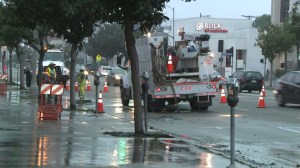 Crews are seen repairing a broken water main in Fairfax on March 21, 2015. (Credit: KTLA)