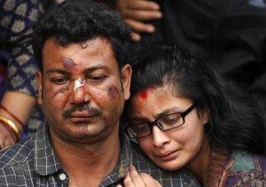 Nepalese residents mourn the death of a relative following an earthquake, at a mass cremation at Pashupatinath in Kathmandu on Sunday, April 26, 2015. (Credit: Prakash Mathema/AFP/Getty Images)