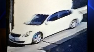 A still from surveillance video shows a white Nissan Altima believed to be involved in abduction of 2-year-old girl in Gardena on April 2, 2015.