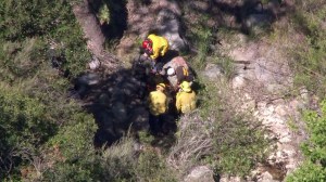 Crews work to recover a body in the Cleveland National Forest on Tuesday, April 28, 2015. (Credit: KTLA)