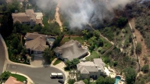 A fire was burning near homes in Ventura County on April 30, 2015. (Credit: KTLA)