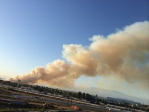 A massive plume of smoke rose above a brush fire in the Chino Hills area on Saturday, April 18, 2015. (Credit: Fredy Avila)