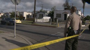 Investigators were searching for “significant portions” of an infant’s dismembered body after discovering its head and leg in South L.A. on April 25, 2015. (Credit: KTLA)