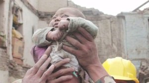 A Nepali baby was rescued from a destroyed building more than 22 hours after a 7.8-magnitude earthquake rattled the country on April 25, 2015. (Credit:  KATHMANDUTODAY.COM )