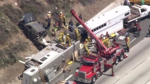 Authorities respond to an animal-trailer crash the 210 Freeway in Sylmar on April 29, 2015. (Credit: KTLA)