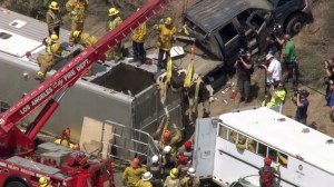 A second cow was hoisted from an overturned trailer after a crash on the 210 Freeway in Sylmar on April 29, 2015. (Credit: Christina Pascucci / KTLA)