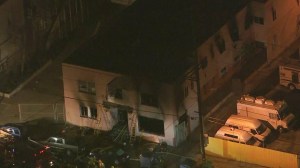 It took fire crews nearly an hour to knock down a fire that burned through a Wilmington hotel on April 2, 2015. (Credit: KTLA) 