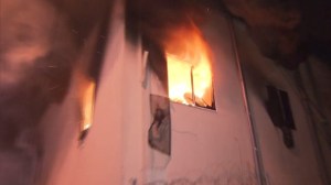 An out-of-control fire was burning at a hotel in Wilmington on April 2, 2015. (Credit: KTLA) 