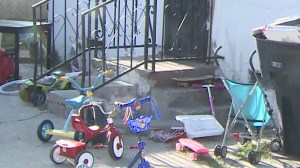 Children's toys could be seen outside a home where a 3-year-old boy was stabbed on May 19, 2015. (Credit: KTLA) 