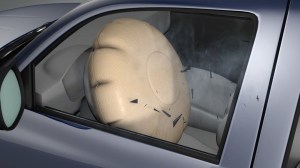 This graphic from the Insurance Institute for Highway Safety shows an airbag expanding, shooting shrapnel toward the driver.