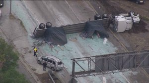 All lanes were blocked on the transition road from the southbound 5 Freeway to the eastbound 60 Freeway in Boyle Heights after a big-rig crash on Monday, May 18, 2015. (Credit: KTLA)