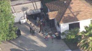 Homicide investigators  on May 19, 2015, were at the scene of a home where a 3-year-old boy who was stabbed. (Credit: KTLA) 