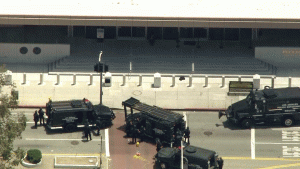 A woman is seen near the front door of the Federal Building during a standoff with authorities Wednesday. (Credit: KTLA)