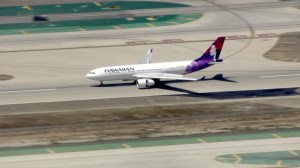A Hawaiian Airlines flight appeared to make a safe emergency landing at LAX on May 18, 2015. (Credit: KTLA)