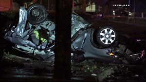 A overturned car involved in a fatal collision in Pomona is seen in this image. (Credit: Loudlabs)