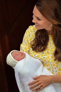 Britain's Catherine, Duchess of Cambridge holds her newly-born daughter, her second child with Britain's Prince William, Duke of Cambridge, as they show her to the media outside the Lindo Wing at St Mary's Hospital in central London, on May 2, 2015. (Credit: John Stillwell/AFP/Getty Images)