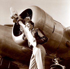 Amelia Earhart seen near the propeller of her Model 10E Electra in 1937.(Credit: Public Domain)