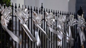 White ribbons commemorating shooting victims are placed on a railing outside Emanuel AME Church in Charleston, South Carolina on June 18, 2015. (Credit: Mladen Antonov/AFP/Getty Images)