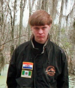 In an image tweeted by authorities in Berkeley County, South Carolina, Dylann Roof seen is wearing a jacket with what appear to be the flags of apartheid-era South Africa and nearby Rhodesia, a former British colony that a white minority ruled until it became independent in 1980 and changed its name to Zimbabwe.