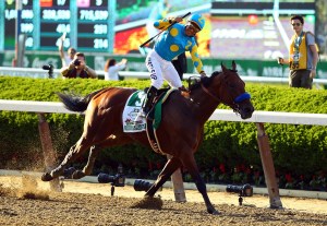 Victor Espinoza, celebrates atop American Pharoah #5, after winning the 147th running of the Belmont Stakes at Belmont Park on June 6, 2015, in Elmont, New York. With the wins American Pharoah becomes the first horse to win the Triple Crown in 37 years.  (Credit: Al Bello/Getty Images)