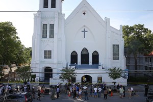 People stand outside the Emanuel A.M.E. Church after a mass shooting at the church that killed nine people on June 18, 2015, in Charleston, South Carolina. (Credit: Joe Raedle/Getty Images)