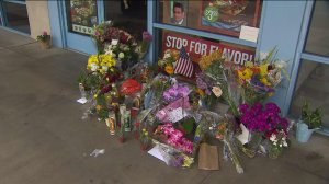 Flowers were left at the Quiznos owned by Patel during a news conference about the search for his killer on June 10, 2015. (Credit: KTLA)