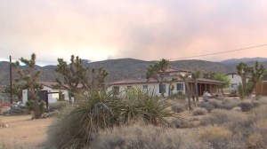 Smoke from the Lake Fire rises in the distance, as seen from the community of Rimrock on June 25, 2015. (Credit: KTLA)