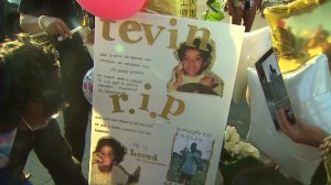 This sign was displayed at a June 1, 2015, vigil for a 19-year-old killed at a car wash in South L.A. four days earlier. (Credit: KTLA)