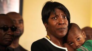 Ezell Ford's mother, Tritobia Ford, holds her son Zaire, 2, while speaking to reporters on June 9, 2015, at the First AME Church of Los Angeles about the L.A. Police Commission's decision in her eldest son's fatal shooting. (Credit: Rick Loomis / Los Angeles Times ) 