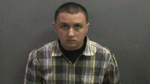 Darreck Michael Enciso is seen in a booking photo released by the Orange County District Attorney's Office. 