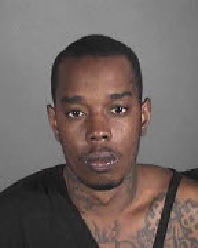 Huston Hughes, 27, is seen in a booking photo. (Credit: Los Angeles Police Department)