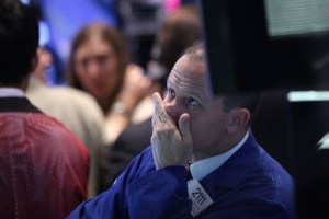 Traders work on the floor of the New York Stock Exchange on July 6, 2015. (Credit: Spencer Platt/Getty Images)