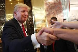 Donald Trump greets supporters, tourists and the curious after taping an interview with Anderson Cooper at a Trump-owned building in mid-town Manhattan on July 22, 2015 in New York City. (Credit: Spencer Platt/Getty Images)