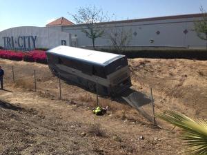 A Greyhound bus is seen in a ditch near the westbound 10 Freeway after a crash on Saturday, July 4, 2015. (Credit: Greg Cappis, Los Angeles News Group)