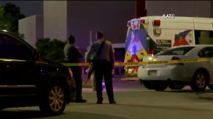 Officials are seen outside a Louisiana theater where a shooting occurred on July 23, 2015. (Credit: KATC)