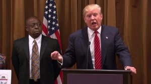 Jamiel Shaw Sr. stands behind Donald Trump at a press conference on July 10, 2015, in Beverly Hills. (Credit: CNN)