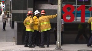 City firefighters worked Aug. 21, 2015, outside a building where an explosion occurred the previous night. (Credit: KTLA)