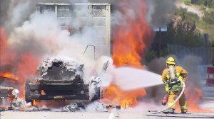 A big-rig exploded into flames on the 405 Freeway on Aug. 24, 2015. (Credit: KTLA)