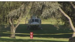 A helicopter is seen after making a hard landing while battling the Lincoln Fire in the Montebello area on Aug. 16, 2015. Everyone on board was OK, according to fire officials. (Credit: KTLA)