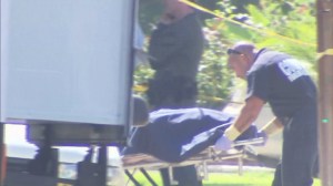 A woman's body was wheeled out of a Burbank home on Aug. 24, 2015. (Credit: KTLA)