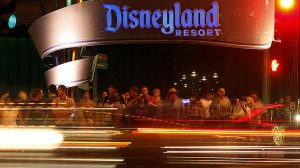 Visitors to Disneyland wait to cross Harbor Boulevard on the eastern side of the famed theme park in Anaheim. (Credit: Luis Sinco / Los Angeles Times)