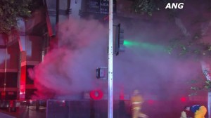 Smoke billowed out of the basement of a downtown L.A. office building following an explosion on Aug. 20, 2015. (Credit: ANG)