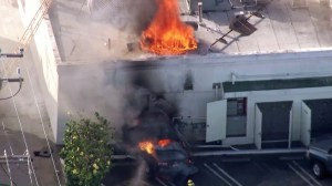 A restaurant in Santa Monica caught fire after a car crashed into the side of the building on Aug. 12, 2015. (Credit: KTLA)