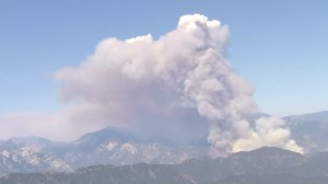 Smoke rises from the San Gabriel Mountains at the Cabin Fire burns Aug. 14, 2015. (Credit: KTLA)