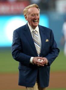 Dodger broadcaster Vin Scully smiles before throwing out the first pitch during ceremonies honoring him on his 64 years of service before the game between the Arizona Diamondbacks and the Los Angeles Dodgers on Aug. 30, 2012, at Dodger Stadium. (Credit: Stephen Dunn/Getty Images)