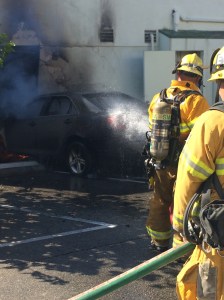 Santa Monica fire crews continued to battle a stubborn blaze that started when a vehicle crashed into the back of a restaurant on Aug. 12, 2015. (Credit: Mark Mester / KTLA)