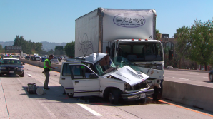 A man and child died after a crash on the northbound 405 Freeway in Van Nuys on Sunday, Aug. 23, 2015. (Credit: KTLA)