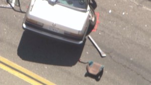 A child's car seat appeared to have been left on the pavement after a crash in Santa Ana on Aug. 3, 2015. (Credit: KTLA)